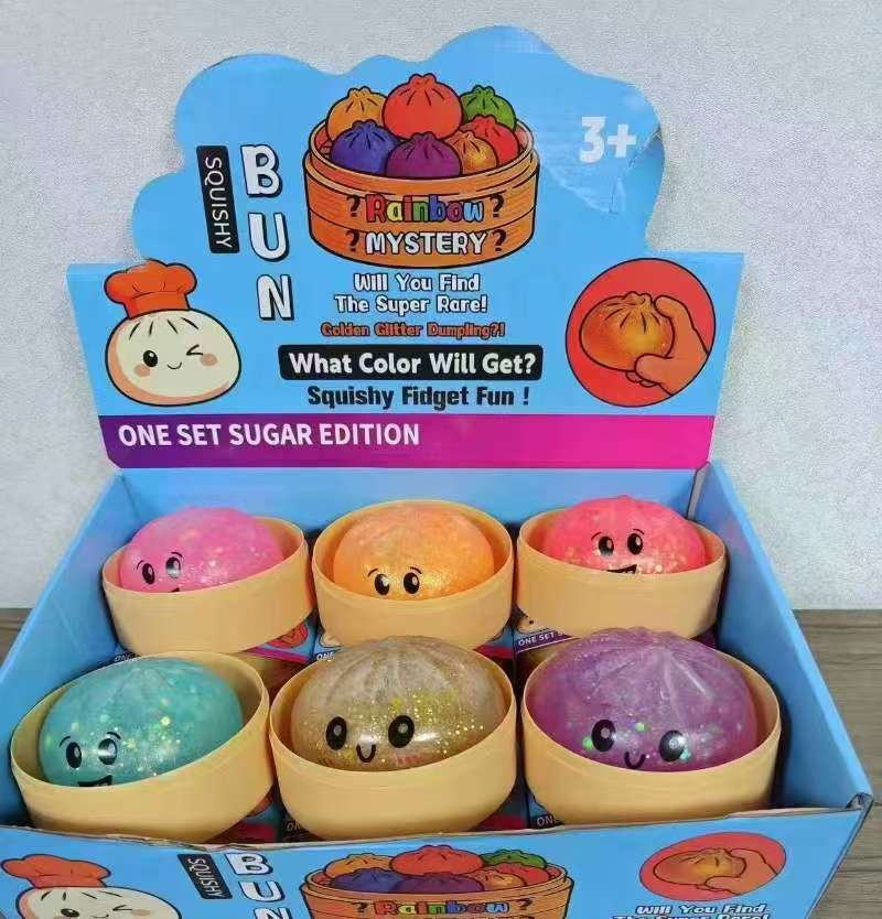 Squishy Bun Rainbow Mystery Sugar Edition display box with 6 colorful squishy dumpling fidget toys